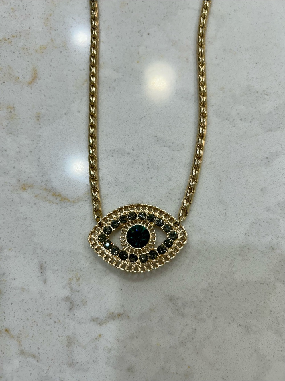 Gold Evil Eye Pendant Necklace with Blue Crystal Accents